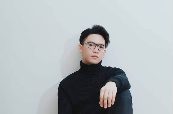 person wearing mock neck